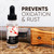 A promotional image for Tinyroots Choji Oil features a 1 fl. oz (30ml) clear glass bottle with a black dropper cap sitting on a rustic wooden surface. The bottle’s label has a traditional Japanese aesthetic, with red cherry blossoms and cloud patterns on a white background above a black section that reads "CHOJI OIL RUST PREVENTION SOLUTION." 

Behind the bottle lies a large, serrated stainless steel blade with a light-colored wooden handle, illustrating the product's intended use for maintaining and protecting gardening and bonsai tools. Large, dark brown and black text in the top right corner of the image boldly states, "PREVENTS OXIDATION & RUST." The entire scene is set against a plain white background, highlighting the product and its primary benefit of preserving the longevity of metal tools.