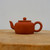 Handmade reddish-brown Yixing zisha teapot with a short curving spout, No. 4