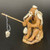 Chinese mud man figurine of an elderly man fishing in a hat and shawl, F-105