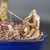 Close-up of the elderly fisherman mud man bonsai figurine