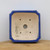 Top-down view of the square notched-corner cobalt blue bonsai pot