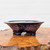 6 inch oval handmade bonsai pot by Roy Minarai in a mottled purple indigo glaze
