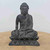 Handmade Buddha statue in weathered dark grey, cross legged on a lotus throne