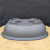 Underside of the charcoal grey oval plastic training pot