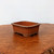Elevated front view of the unglazed brownish red terracotta pot