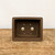 Overhead view of the rectangular unglazed dark brown bonsai pot