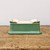 Underside of the rectangular green glazed ceramic bonsai pot