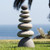 Medium giant rock cairn of seven rounded stones stacked largest to smallest