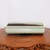 Front view of the shallow rectangular cream glazed Japanese pot