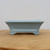 Side profile of the small rectangular light blue glazed bonsai pot