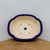 Overhead view of the oval pot's scalloped cloud rim
