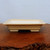 Angled view of the rectangular cream glazed ceramic bonsai pot