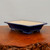 Rectangular high gloss glazed bonsai pot on a dark wooden stand