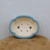 Top-down view of the light blue pot's quatrefoil lobed rim