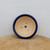 Top-down view of the round pot with a navy blue glazed rim