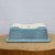 Underside of the rectangular light blue glazed bonsai pot