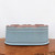 Underside of the light blue glazed oval bonsai pot
