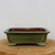 Front view of the nine inch rectangular glossy green glazed pot