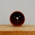 Top-down view into the small round unglazed terracotta pot