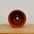 Top-down view into the round unglazed terracotta bonsai pot