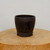 Round unglazed dark brown pot with black Chinese calligraphy
