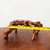 Close-up of a gnarled polished wooden root display stand
