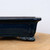 Close-up profile of the rectangular pot in glossy dark navy blue