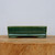 Rectangular Yixing pot in deep glossy emerald green on a wood block