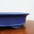 Close-up side profile of the rectangular cobalt blue glazed pot