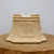 Cream glazed cascade pot, model 2300, on a natural wood slab