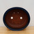 Top-down view of the oval Yixing pot's rim and interior
