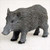 A detailed dark grey razorback hog figurine designed as an accessory for bonsai tree displays. The miniature pig sculpture features an intricately molded surface that mimics the appearance of thick, coarse fur with numerous fine lines and ridges. It is shown in a standing pose, featuring a small white tusk and black hooves, set against a plain light-colored background. This figurine is intended to be placed within a bonsai pot to create a realistic natural scene.