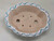 Top-down view of the 10 inch painted pot's scalloped cloud-like shape