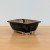 Bruce Lenore handmade bonsai pot No. 32 angled on a light brown wood surface