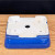 Underside of the small rectangular glossy blue glazed pot