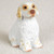 Miniature Clumber Spaniel figurine in a patient upright sitting pose