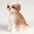 Miniature tan Shih Tzu figurine with a sport cut coat, sitting upright