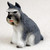 Miniature salt and pepper Schnauzer figurine seated, gray and white