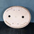 Underside of the 16 inch unglazed oval Yixing pot in light tan clay