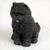 Miniature black Chow Chow figurine with the breed's stocky build and dense coat
