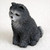 Miniature blue Chow Chow figurine sitting upright and attentive