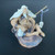 Chinese mudman figurine of an elderly fisherman on a textured dark rock, F-047