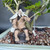 Close-up of the handcrafted ceramic elderly fisherman figurine