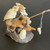 Chinese mud man figurine of an elderly fisherman on a craggy rock, F-002