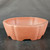 This detailed image features a 13-inch Yixing clay bonsai pot, presented on a dark, textured surface against a moody, dark grey background. The pot is crafted from traditional, unglazed Yixing clay, exhibiting a warm and matte reddish-brown, earthy tone. 

Its design is a sophisticated take on a round pot, featuring elegantly lobed or scalloped sides that create a gentle, undulating, petal-like profile around its circumference. A sturdy, smooth rim follows this same scalloped pattern. The pot is relatively deep, making it suitable for a variety of bonsai styles and species. At the base, four low-profile, integrated feet are formed by graceful, arched cutouts, providing both stability and a sense of lift. This classic ceramic vessel combines traditional Chinese craftsmanship with a functional, aesthetically pleasing shape, ideal for showcasing a medium-sized bonsai tree.