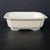 Front view of the cream square pot and its stepped rim