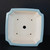 Overhead view of the 9 inch square pot's light blue glazed rim