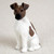 Miniature brown and white Smooth Fox Terrier figurine seated and facing left