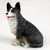 Miniature Cardigan Welsh Corgi figurine sitting upright on its haunches