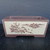 Front view of the 7 inch dark earthy reddish brown Yixing pot